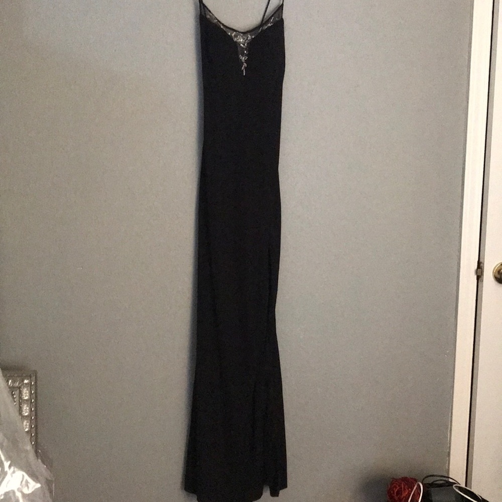 Black evening gown with iridescent detail.